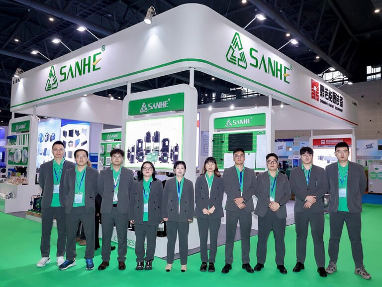 Sanhe HVAC booth at RACC 2025 in Hangzhou showcasing advanced heating, ventilation, and air conditioning systems. The image features a professional team presenting eco-friendly climate control product.