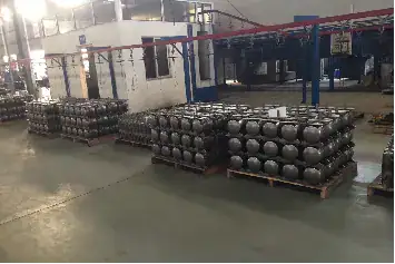 Steel balls stacked on pallets in a manufacturing facility for industrial applications.