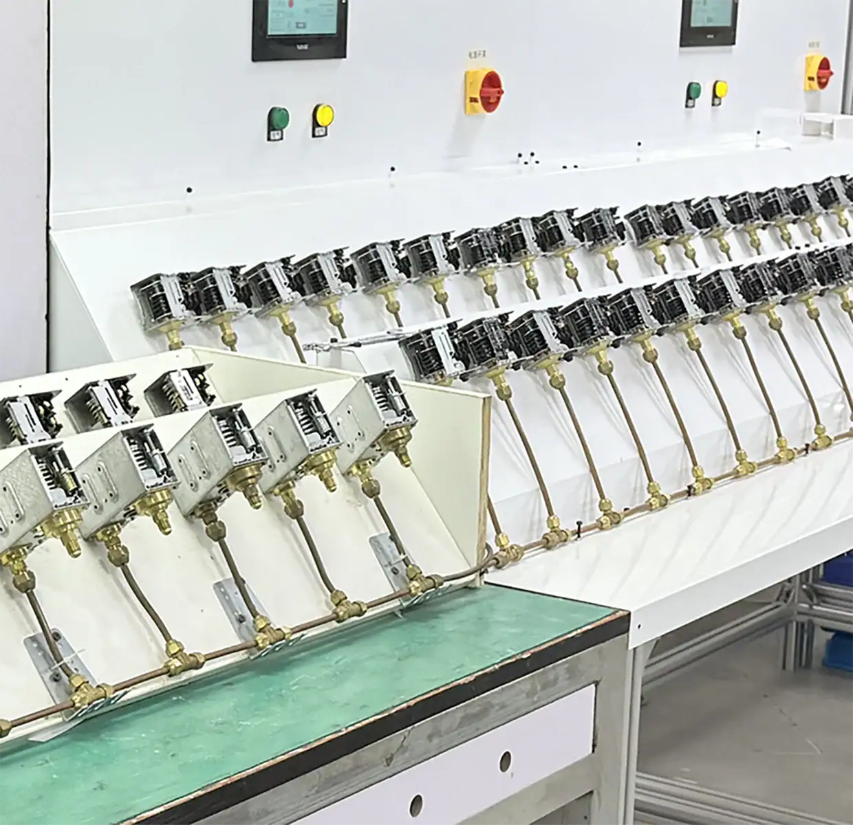 Industrial automation control panel with multiple wiring connections and switches for manufacturing processes.