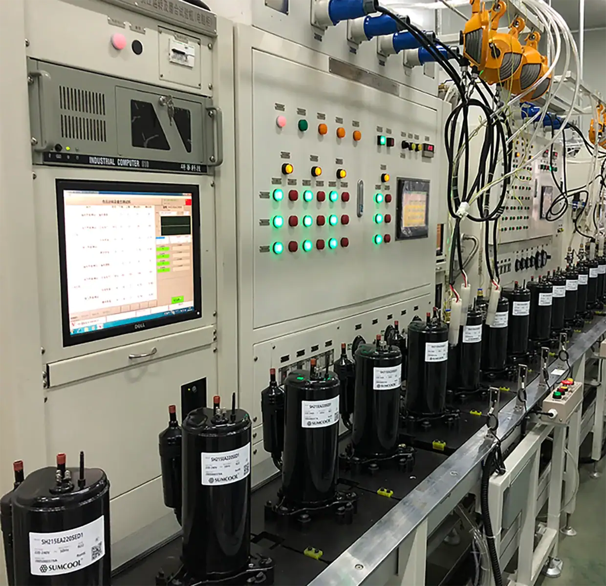Industrial refrigeration control panel with compressors and electronic interface for HVAC systems.