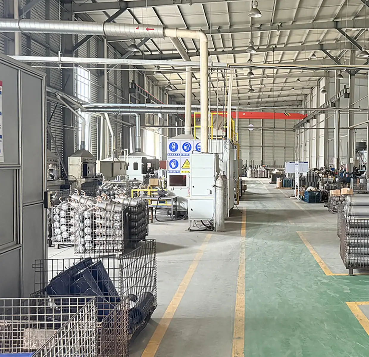 Industrial manufacturing warehouse with machinery, metal products, and storage racks in a spacious factory setting.