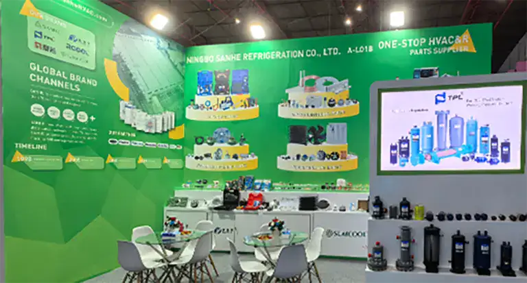 Indoor HVAC equipment display at ACAIR in Colombia, showcasing refrigeration and air conditioning products with digital screens and product shelves.