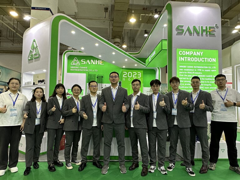 Sanhe HVAC booth at 2023 RACC in Ningbo showcasing innovative HVAC solutions. The team stands confidently in front of the exhibition booth, highlighting the company's commitment to quality and sustain.