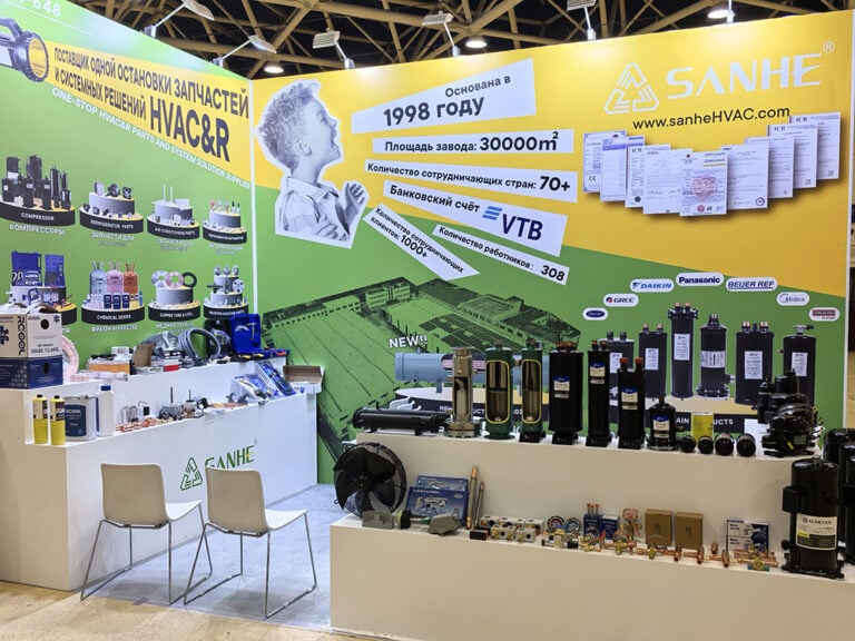 Display of HVAC and refrigeration parts at Sanhe HVAC booth, showcasing a variety of compressors, valves, and control units for climate control solutions.
