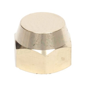 Close-up of a brass cap nut used in plumbing, showcasing its smooth, rounded top and threaded base for secure fittings.