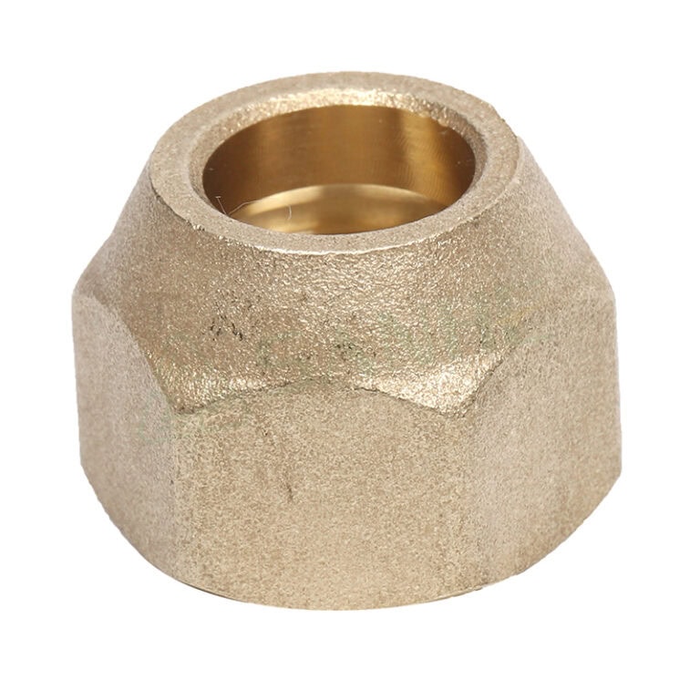 Close-up of a brass forged nut used in plumbing fittings, showcasing its textured surface and internal threading for secure connections.