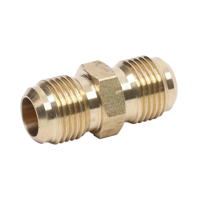 Close-up of a brass pipe fitting with threaded ends, used in plumbing and HVAC systems.