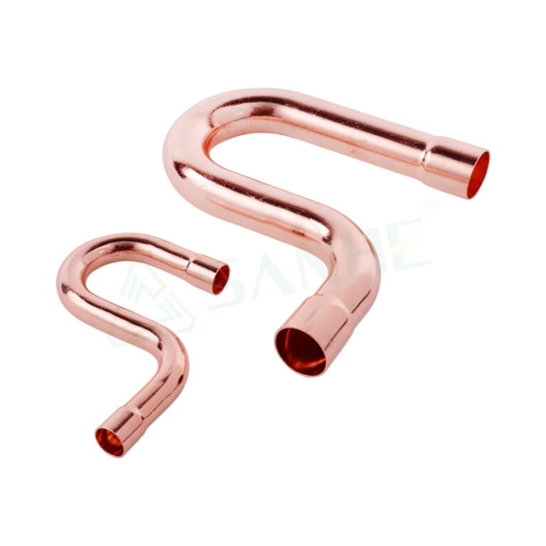 Copper pipe fittings for plumbing, featuring a trap with a C-shaped bend for drainage systems.